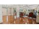 Spacious living room featuring hardwood floors, elegant columns, and recessed lighting at 299 Saint Marys Nw Ln, Marietta, GA 30064