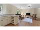 Living room area with kitchenette, hard wood floors, and natural light at 299 Saint Marys Nw Ln, Marietta, GA 30064