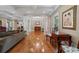 Elegant living room with hardwood floors, coffered ceilings, and columns at 299 Saint Marys Nw Ln, Marietta, GA 30064