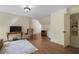 Living room with hardwood floors, a TV, and a door to the bathroom at 299 Saint Marys Nw Ln, Marietta, GA 30064