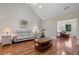 Living room features hardwood floors, stylish furniture, high ceilings, and a charming lamp at 299 Saint Marys Nw Ln, Marietta, GA 30064