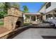 Inviting outdoor area features a stone fireplace and covered porch, perfect for relaxation and entertaining at 299 Saint Marys Nw Ln, Marietta, GA 30064