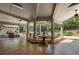 Large covered patio with ample seating areas, tile flooring, and an elegant outdoor ambiance at 299 Saint Marys Nw Ln, Marietta, GA 30064