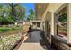 Outdoor patio showcasing a stone fireplace and landscaped gardens creating a serene outdoor space at 299 Saint Marys Nw Ln, Marietta, GA 30064