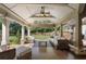 Spacious covered patio with outdoor seating and views of the landscaped backyard at 299 Saint Marys Nw Ln, Marietta, GA 30064