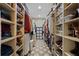 Spacious walk-in closet with custom shelving providing ample storage space for clothes and accessories at 299 Saint Marys Nw Ln, Marietta, GA 30064