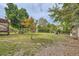 Backyard with mature landscaping, brick accents, and plenty of room at 1766 Scholar Dr, Lawrenceville, GA 30044