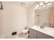 Bright bathroom featuring a toilet, vanity, and shower at 1766 Scholar Dr, Lawrenceville, GA 30044
