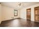Bedroom features include neutral walls, hardwood flooring, and door at 1766 Scholar Dr, Lawrenceville, GA 30044