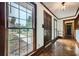 Inviting hallway with wood flooring and large window letting in natural light at 1766 Scholar Dr, Lawrenceville, GA 30044