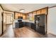Bright kitchen featuring dark lower cabinets, light upper cabinets, and modern appliances at 1766 Scholar Dr, Lawrenceville, GA 30044