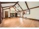 Spacious living room with hardwood floors, vaulted ceilings, and brick fireplace at 1766 Scholar Dr, Lawrenceville, GA 30044