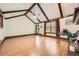 Large living room featuring hardwood floors, a brick fireplace and vaulted ceilings at 1766 Scholar Dr, Lawrenceville, GA 30044