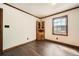 Cozy room with dark wood trim, flooring, and a bright window at 1766 Scholar Dr, Lawrenceville, GA 30044