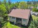 Aerial view of the home's back exterior, featuring multi-level deck and fenced yard at 2402 Jasmine Glen Dr, Buford, GA 30519