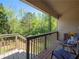 Relaxing covered back porch with wooded view, perfect for enjoying the outdoors at 2402 Jasmine Glen Dr, Buford, GA 30519