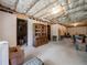 Spacious unfinished basement featuring plenty of storage and potential for customization at 2402 Jasmine Glen Dr, Buford, GA 30519