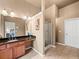 Bathroom featuring granite countertops, vanity area, tile floors and stand-up shower at 2402 Jasmine Glen Dr, Buford, GA 30519