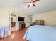 Bright bedroom with hardwood floors, vaulted ceiling, flatscreen TV and ensuite bathroom at 2402 Jasmine Glen Dr, Buford, GA 30519