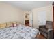 Bedroom with hardwood floors, ceiling light, sitting chair, and ensuite bathroom at 2402 Jasmine Glen Dr, Buford, GA 30519