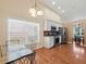 Bright kitchen with eat-in dining area, stainless appliances, and hardwood floors at 2402 Jasmine Glen Dr, Buford, GA 30519