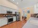 Well-appointed kitchen featuring stainless steel appliances and hardwood flooring at 2402 Jasmine Glen Dr, Buford, GA 30519
