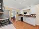 Bright kitchen with stainless steel appliances and an opening to the dining area at 2402 Jasmine Glen Dr, Buford, GA 30519