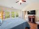 Bright main bedroom with large windows and hardwood floors at 2402 Jasmine Glen Dr, Buford, GA 30519
