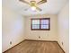 Cozy bedroom featuring neutral walls, carpet flooring, a ceiling fan, and natural light from a window at 2645 Davenport Rd, Duluth, GA 30096
