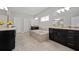 Luxury bathroom with a soaking tub, granite countertop, and black cabinets at 4188 Fawn Ivy Ln, Marietta, GA 30064