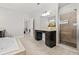 Lavish bathroom boasting double sinks, soaking tub, and a tiled glass shower at 4188 Fawn Ivy Ln, Marietta, GA 30064