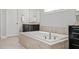 Bathroom showcasing a large soaking tub with granite surround at 4188 Fawn Ivy Ln, Marietta, GA 30064