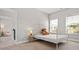 Cozy bedroom featuring a white metal bed frame and large window at 4188 Fawn Ivy Ln, Marietta, GA 30064