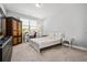 Bright bedroom featuring a window, white wooden bed frame, and desk area at 4188 Fawn Ivy Ln, Marietta, GA 30064