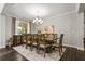 Dining room with hardwood floors, chandelier, and large table and chairs for Gathering meals at 4188 Fawn Ivy Ln, Marietta, GA 30064