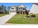 Lovely home featuring a brick facade, a well-manicured lawn, and a two-car garage at 4188 Fawn Ivy Ln, Marietta, GA 30064