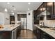 Updated kitchen featuring a large island, stainless steel appliances, granite countertops, and dark cabinetry at 4188 Fawn Ivy Ln, Marietta, GA 30064