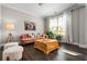 Bright living room with hardwood floors, a cozy sofa, and decorative accents at 4188 Fawn Ivy Ln, Marietta, GA 30064