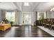 Open-concept living room with hardwood floors, high ceilings, and plenty of natural light at 4188 Fawn Ivy Ln, Marietta, GA 30064