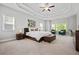 Spacious primary suite with a tray ceiling, lots of natural light, and carpet flooring at 4188 Fawn Ivy Ln, Marietta, GA 30064