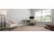 Well-lit office with desk, chair, floor lamp, and bright windows at 4188 Fawn Ivy Ln, Marietta, GA 30064