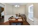 Traditional dining room features dark wood floors, wainscoting, and a classic chandelier at 102 Hill Crest Cir, Hiram, GA 30141