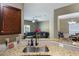 Open-concept kitchen with granite countertops and a view into the cozy living room at 102 Hill Crest Cir, Hiram, GA 30141