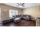 Comfortable living room with hardwood floors, a large sectional sofa, and natural light at 102 Hill Crest Cir, Hiram, GA 30141