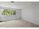 Bright bedroom with dual windows, light carpet, and neutral painted walls at 1784 Timber Valley Se Way, Smyrna, GA 30080