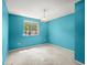 Bedroom with natural light from window, carpeted floor, and blue painted walls at 1784 Timber Valley Se Way, Smyrna, GA 30080