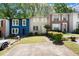 Row of townhouses featuring green spaces, parking and diverse architectural styles at 1784 Timber Valley Se Way, Smyrna, GA 30080