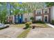 Suburban townhouse complex with mature trees and a spacious parking area at 1784 Timber Valley Se Way, Smyrna, GA 30080