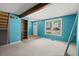 Bright living room featuring a large window, exposed beam, and built-in bookshelf at 1784 Timber Valley Se Way, Smyrna, GA 30080