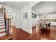 Inviting foyer with hardwood floors, staircase, and an open view into the dining room at 2580 Defoors Ferry Nw Rd, Atlanta, GA 30318